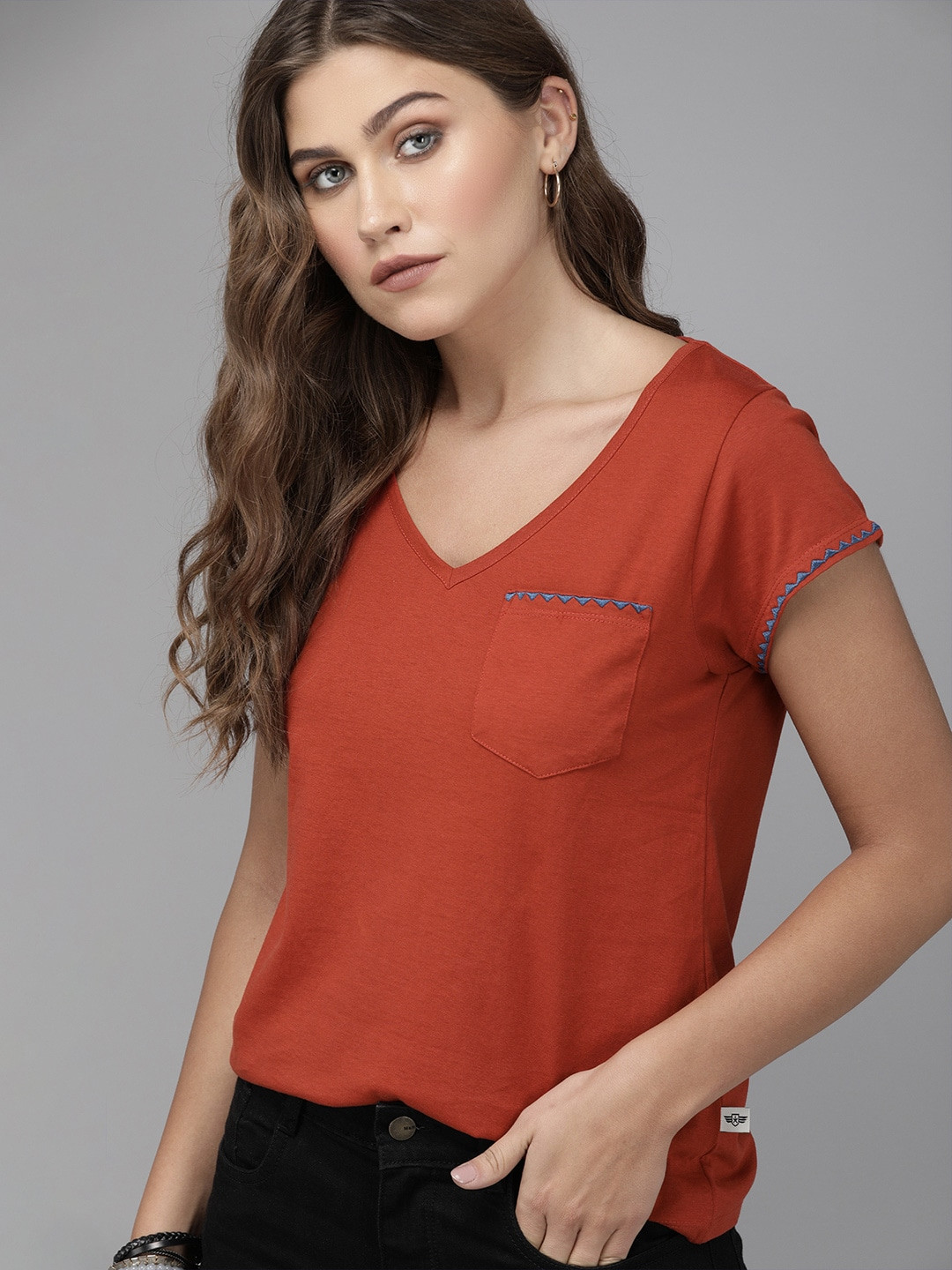 

The Roadster Lifestyle Co Women Rust Red Solid V-Neck T-shirt with Embroidered Pocket Detailing