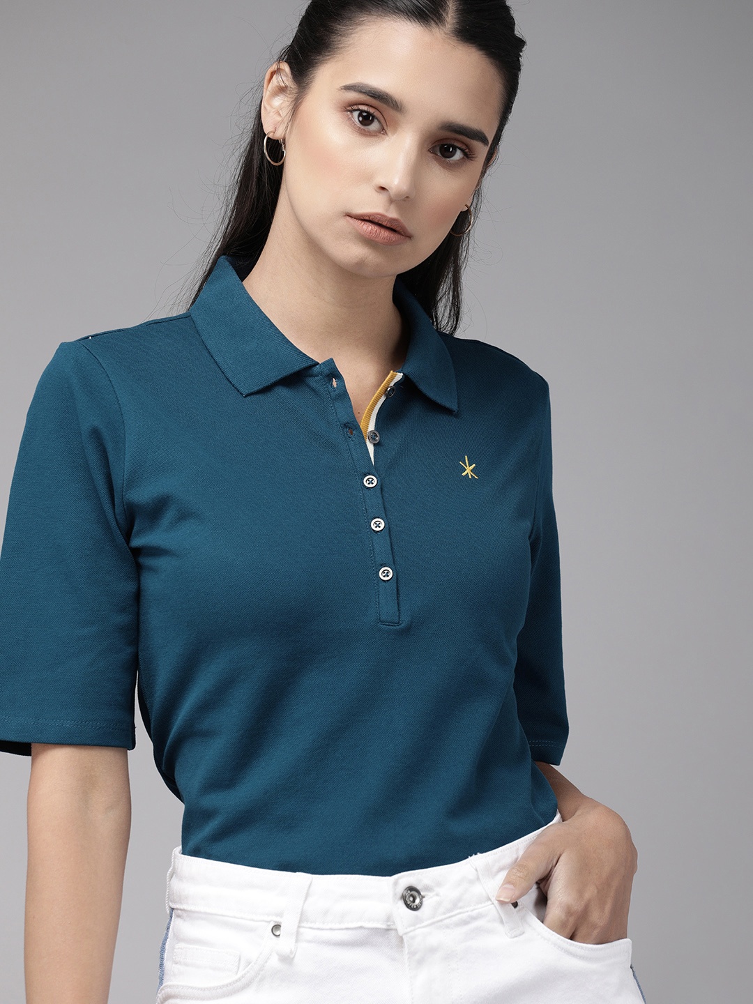 

Roadster Women Teal Blue Solid Polo Collar T-shirt