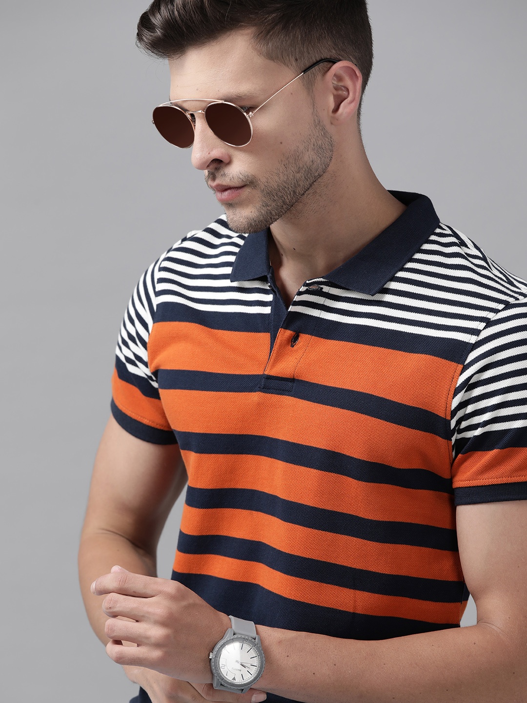 

Roadster Men Navy Blue & Rust Orange Striped Polo Collar Pure Cotton T-shirt
