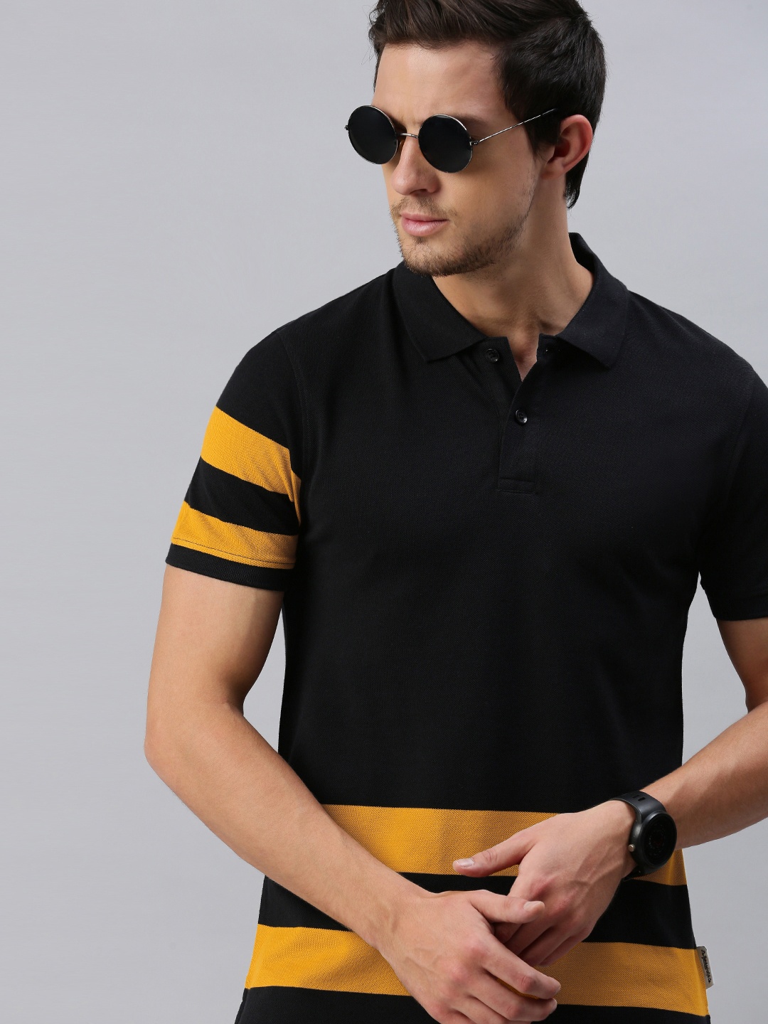 

The Roadster Lifestyle Co Men Black orange Striped Polo Collar Pure Cotton T-shirt