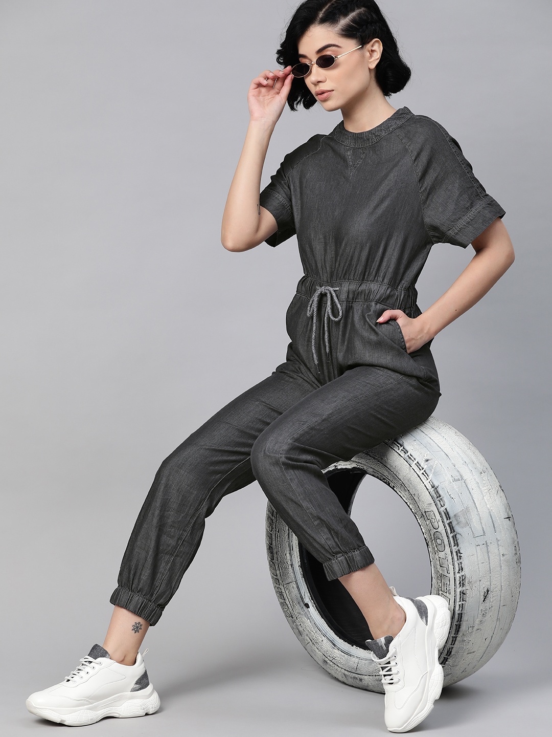 

The Roadster Lifestyle Co Charcoal Grey Solid Denim Jogger Fit Basic Jumpsuit