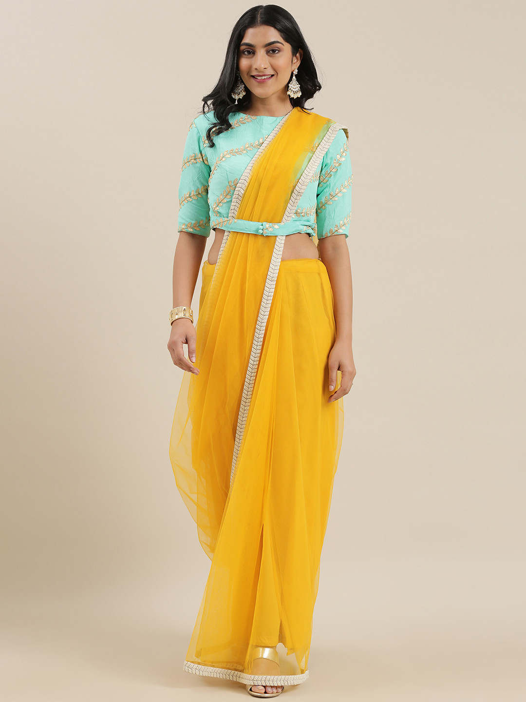 

Ethnovog Net Saree With Stitched Blouse, Mustard