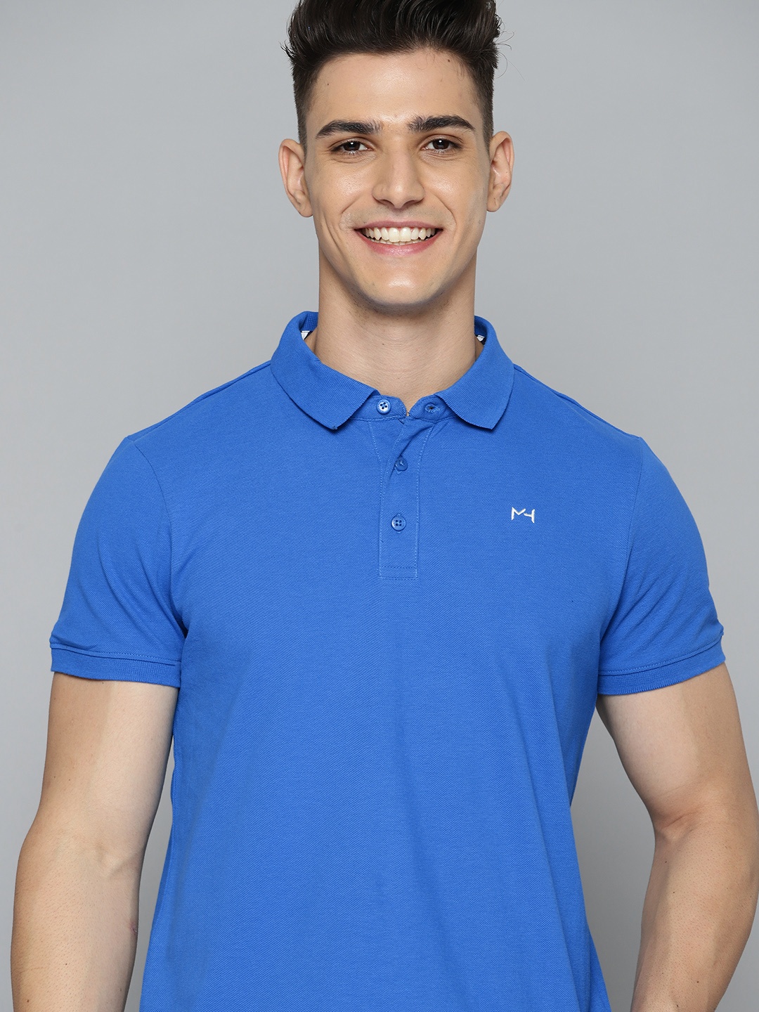 

Mast & Harbour Men Blue Pure Cotton Solid Polo Collar T-shirt