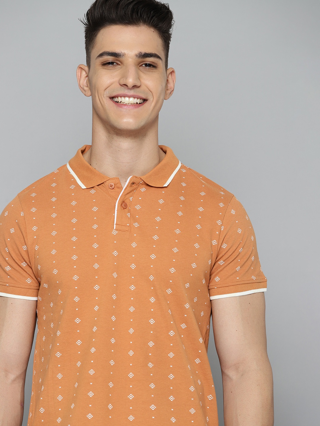 

Mast & Harbour Men Rust Orange & Off-White Pure Cotton Printed Polo Collar T-shirt