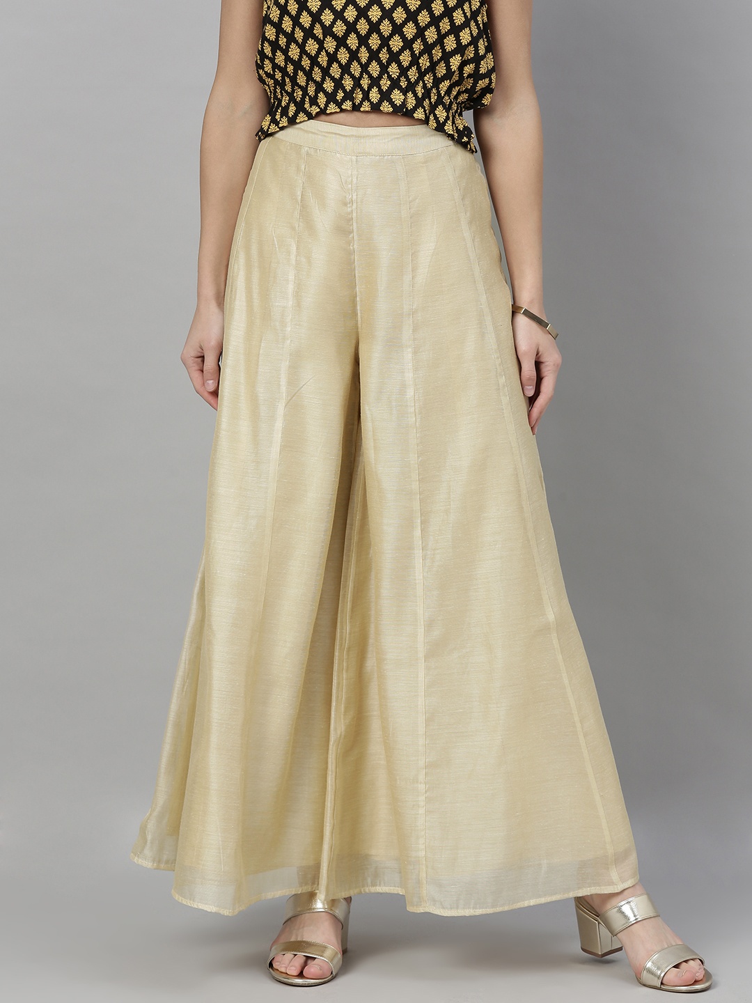 

Global Desi Women Cream-Coloured Solid Flared Palazzos