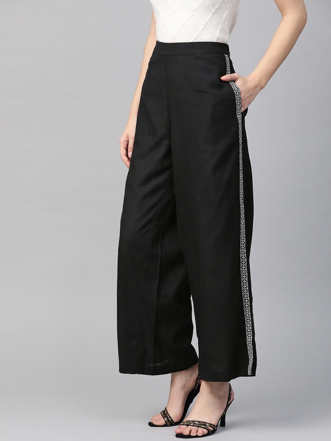 

Global Desi Women Black Regular Fit EcoVero RegularSolid Parallel Trousers