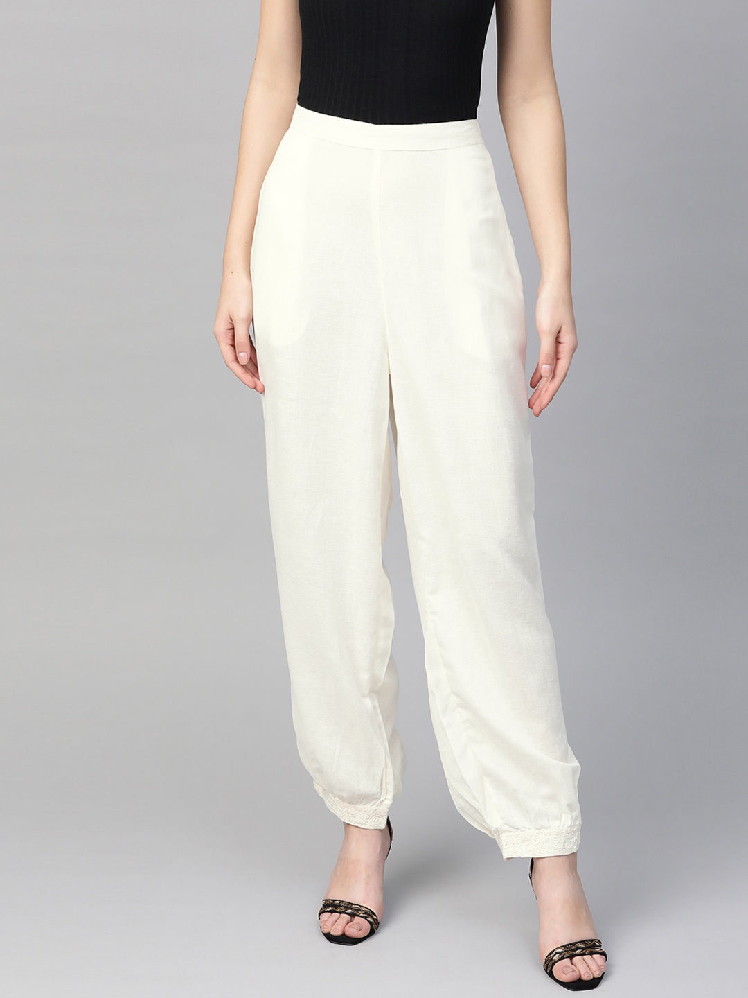 

Global Desi Women Off-White Regular Fit EcoVero RegularSolid Harem Trousers