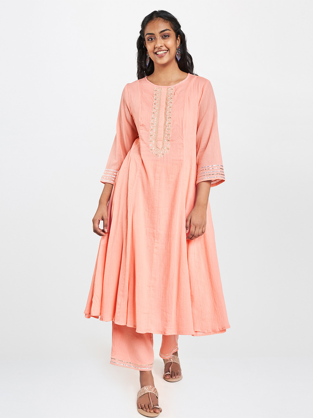 

Global Desi Women Peach Yoke Design Thread Work Kurta with Palazzos