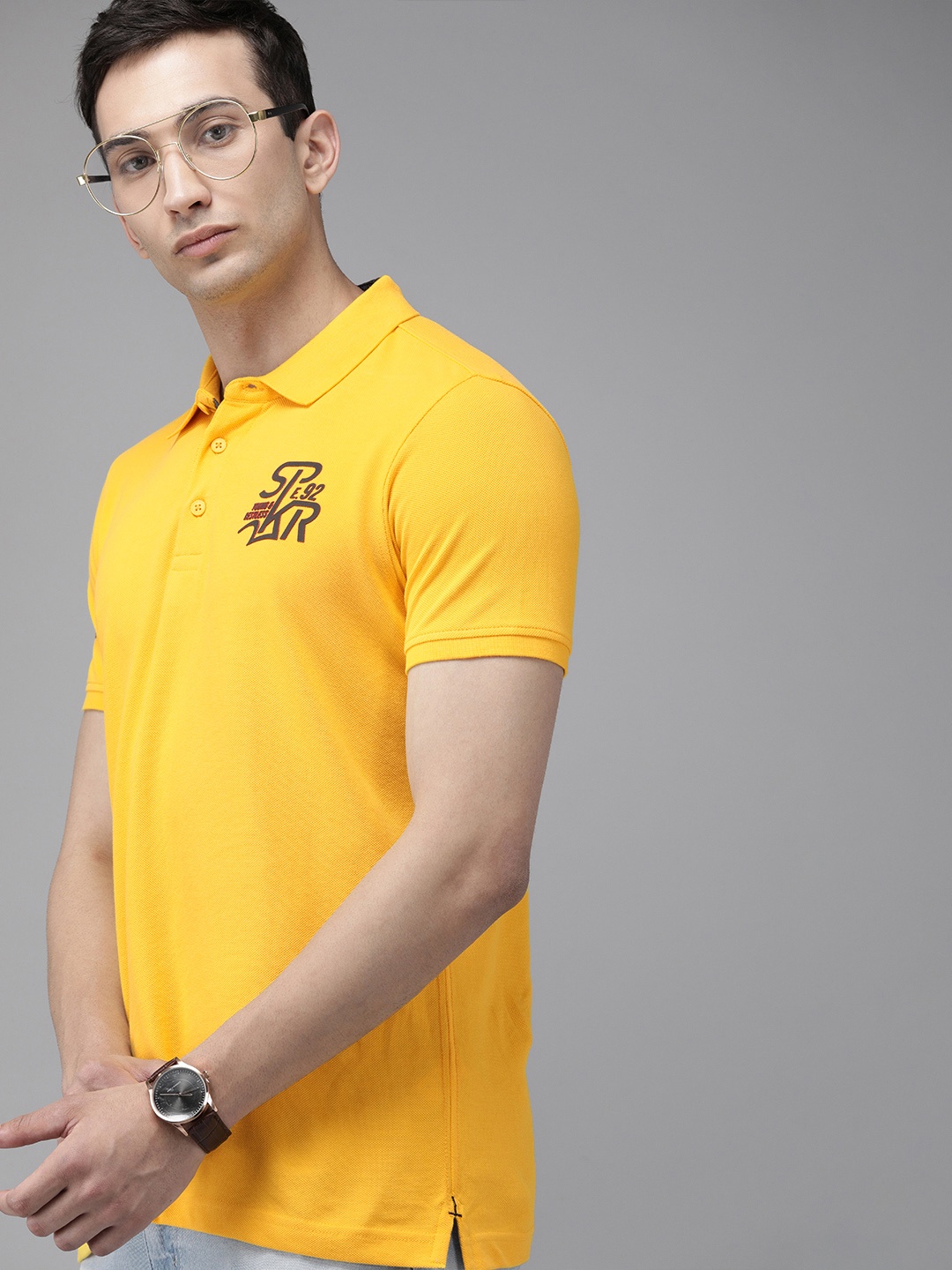 

SPYKAR Men Yellow Solid Polo Collar Pure Cotton T-shirt with Print Detail