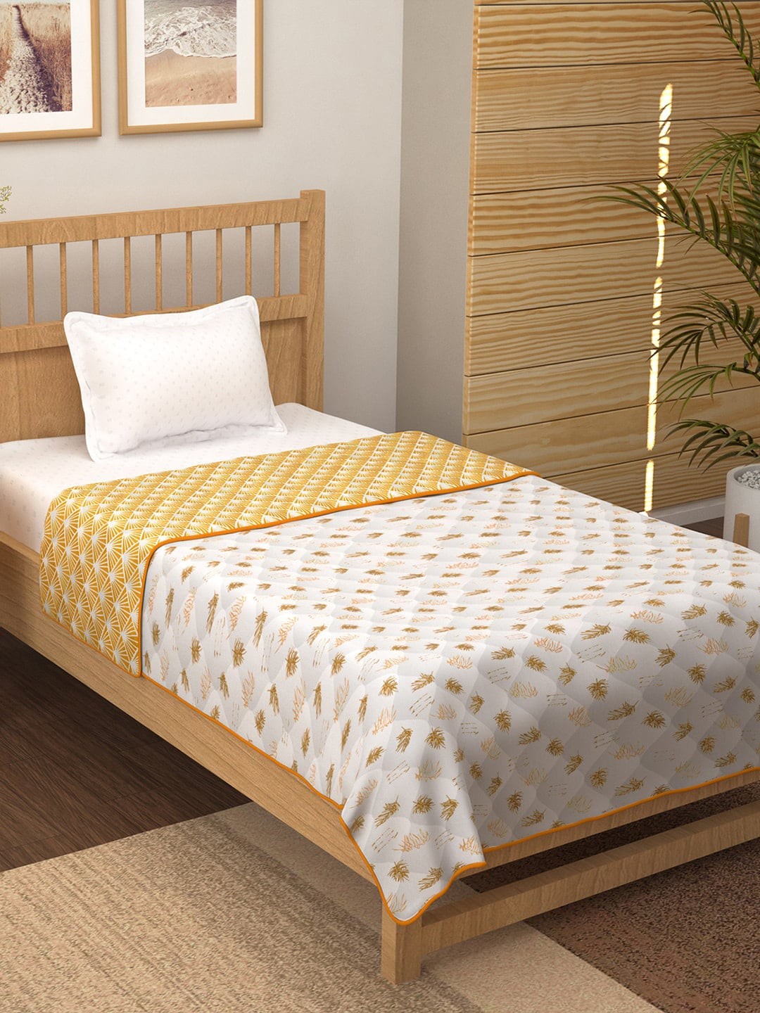 

Story@home Yellow & White Geometric Leaf 150 GSM Cotton Reversible Single Bed Comforter