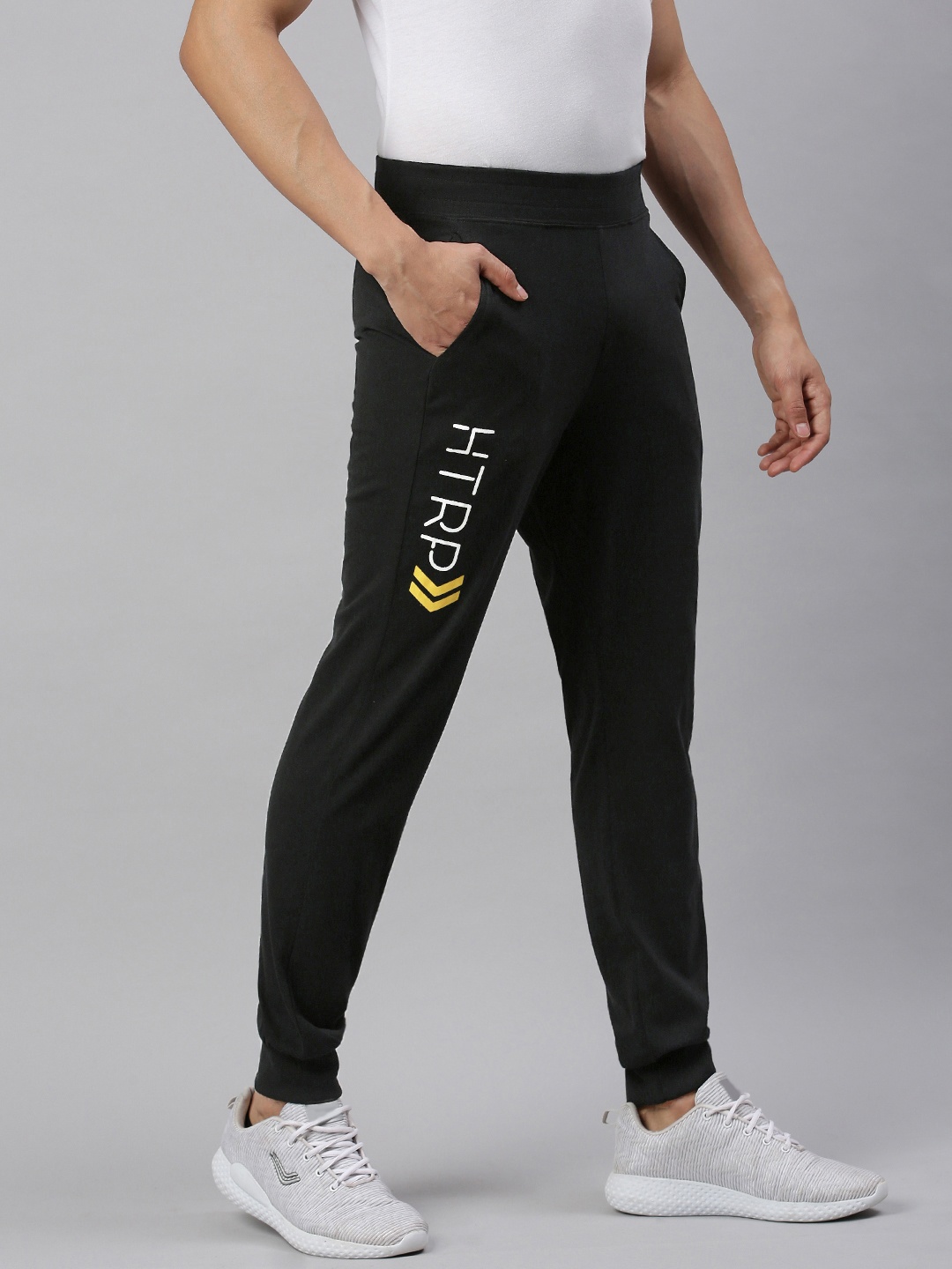 

Huetrap Men Black Solid Straight-Fit Sustainable Joggers with Printed Detail