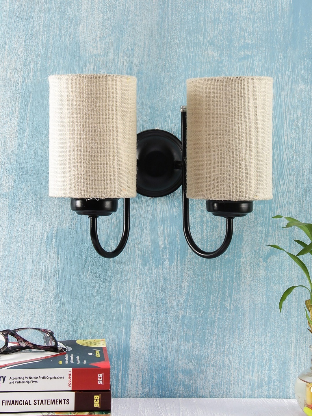 

Devansh White Solid Contemporary Jute Armed Sconce