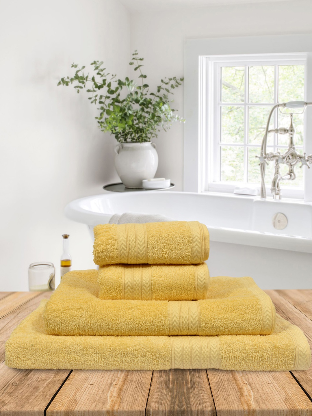 

BOMBAY DYEING Set Of 4 Yellow Solid 550 GSM Towels