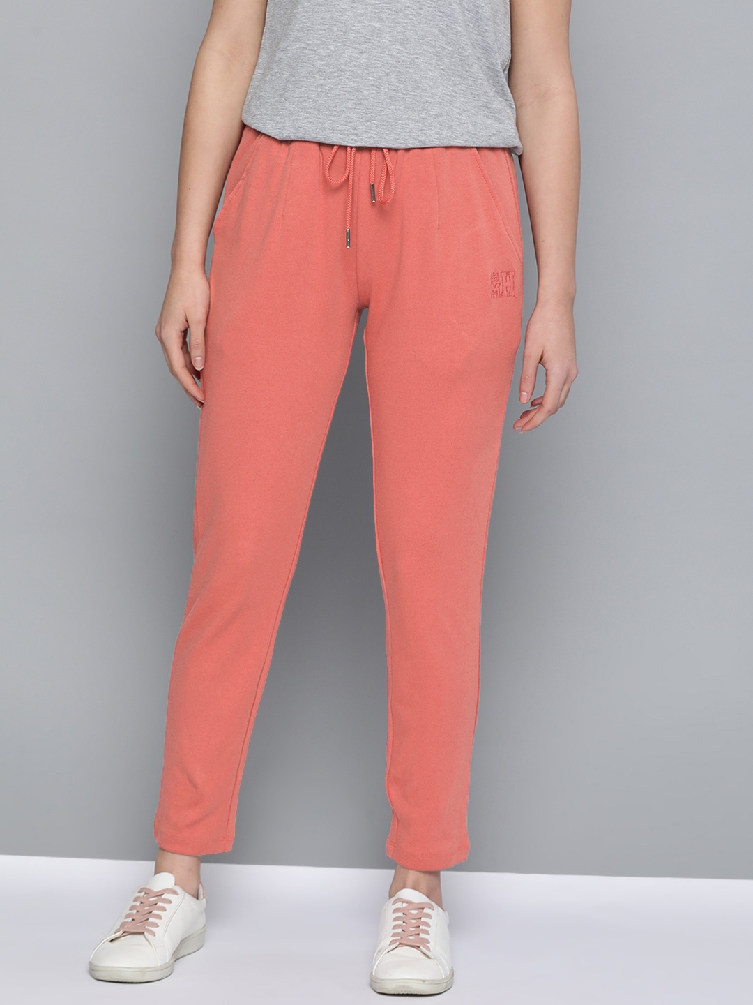 

Mast & Harbour Women Coral Pink Solid Pure Cotton Track Pants, Peach