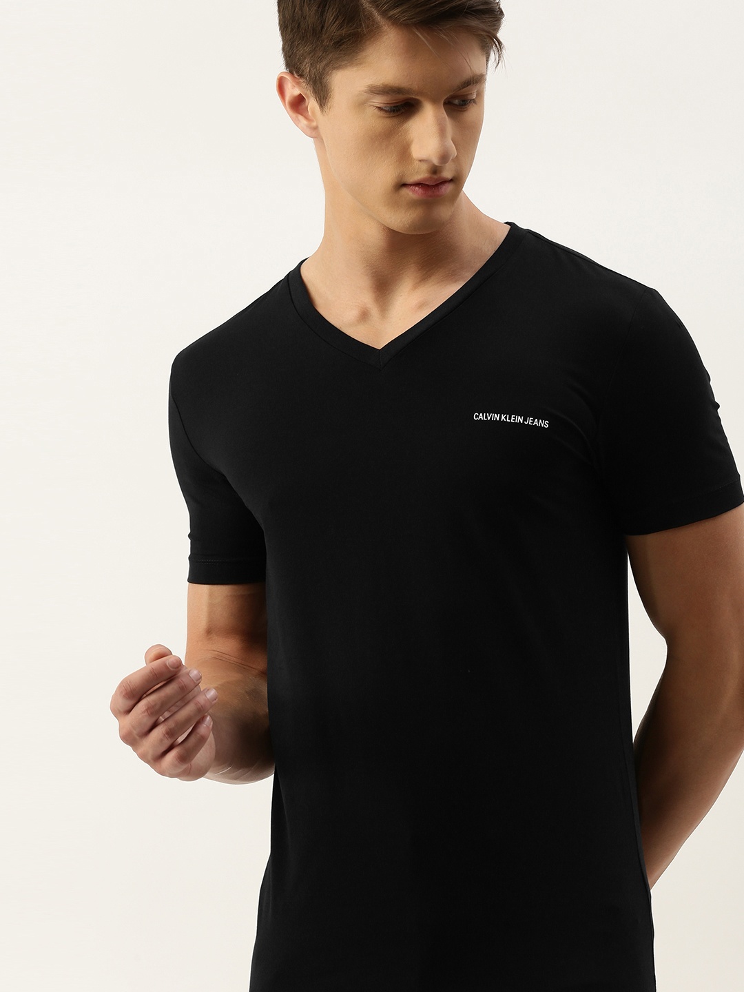 

Calvin Klein Jeans Men Black Slim Fit Solid V-Neck T-shirt with Printed Detailing