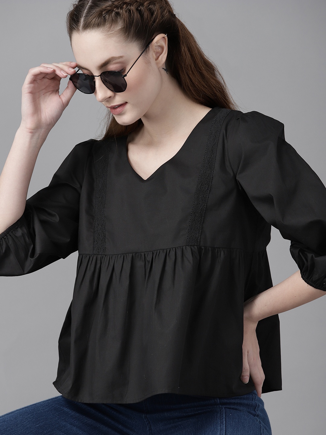 

The Roadster Lifestyle Co Women Black Cotton Solid A-Line Top with Lace-Up Detail
