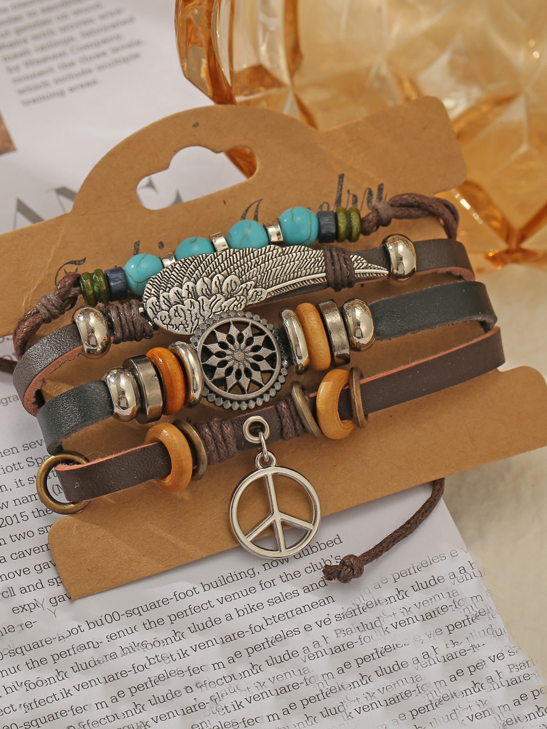

Jewels Galaxy Women Brown & Silver-Toned Multistrand Beaded Bracelet With Drop Charms