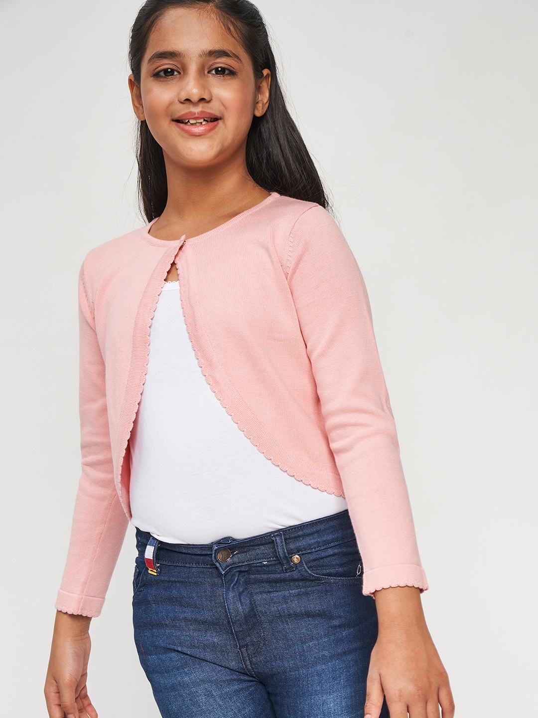 

Global Desi Girls Pink Solid Cotton Button Shrug