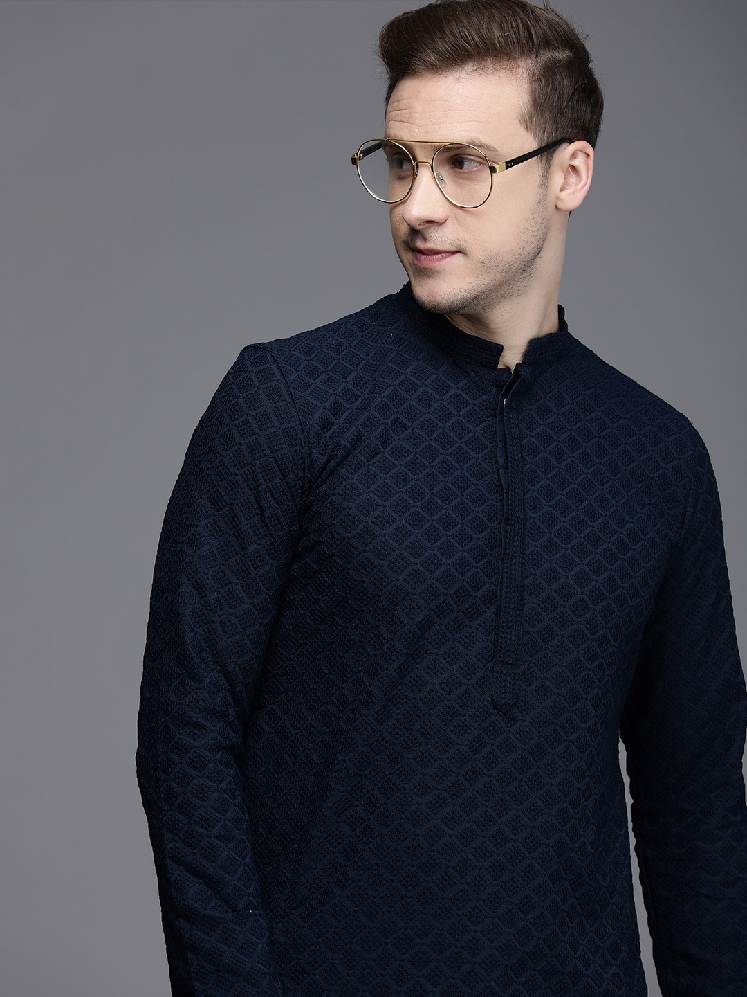 

Manyavar Men Navy Blue & White Embroidered Kurta with Churidar