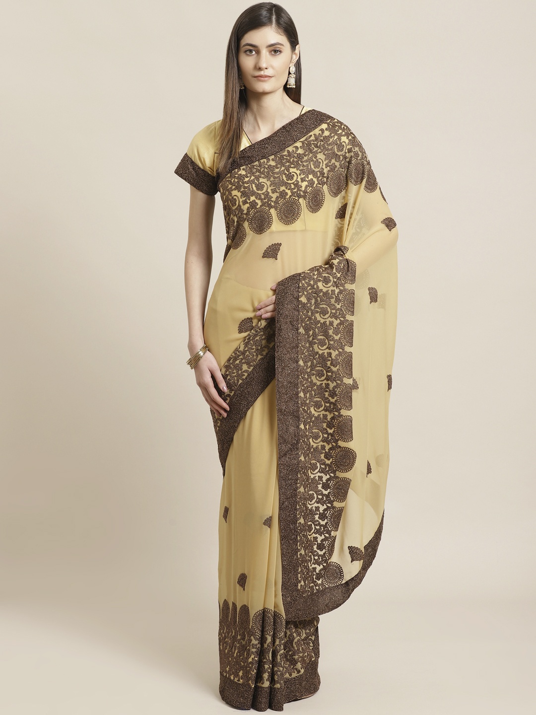 

Readiprint Fashions Beige & Brown Embroidered Saree