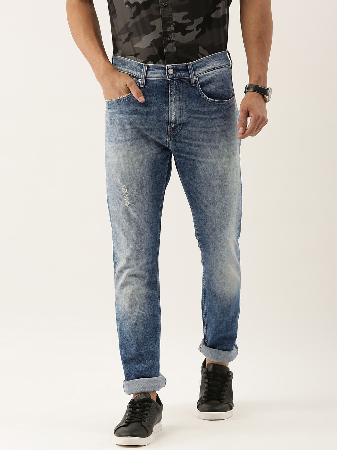 

Calvin Klein Jeans Men Blue Modern Tapered Fit Mid-Rise Low Distress Stretchable Jeans