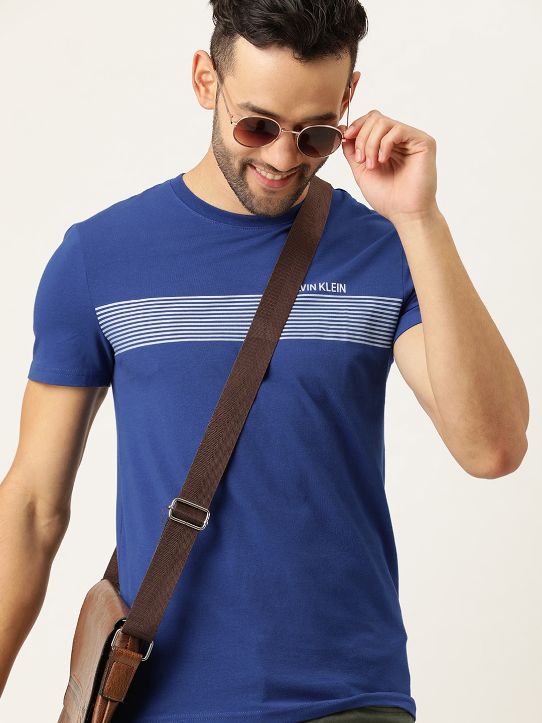 

Calvin Klein Jeans Men Blue & White Slim Fit Striped Round Neck T-shirt