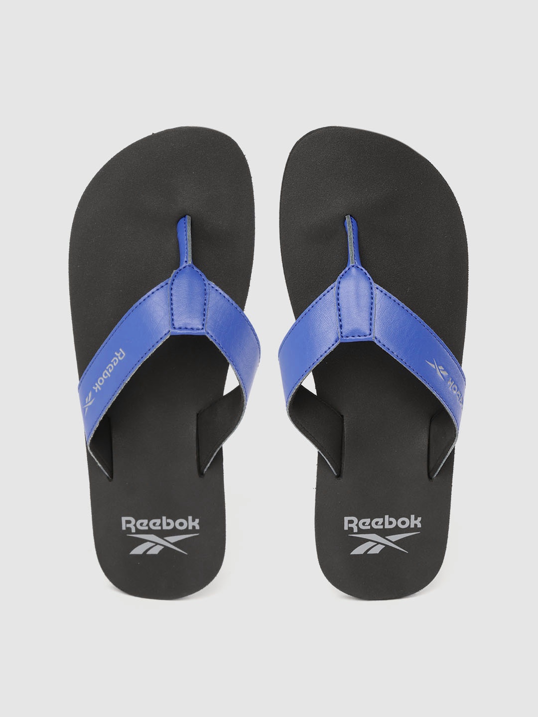 

Reebok Men Blue & Black Solid Thong Flip-Flops
