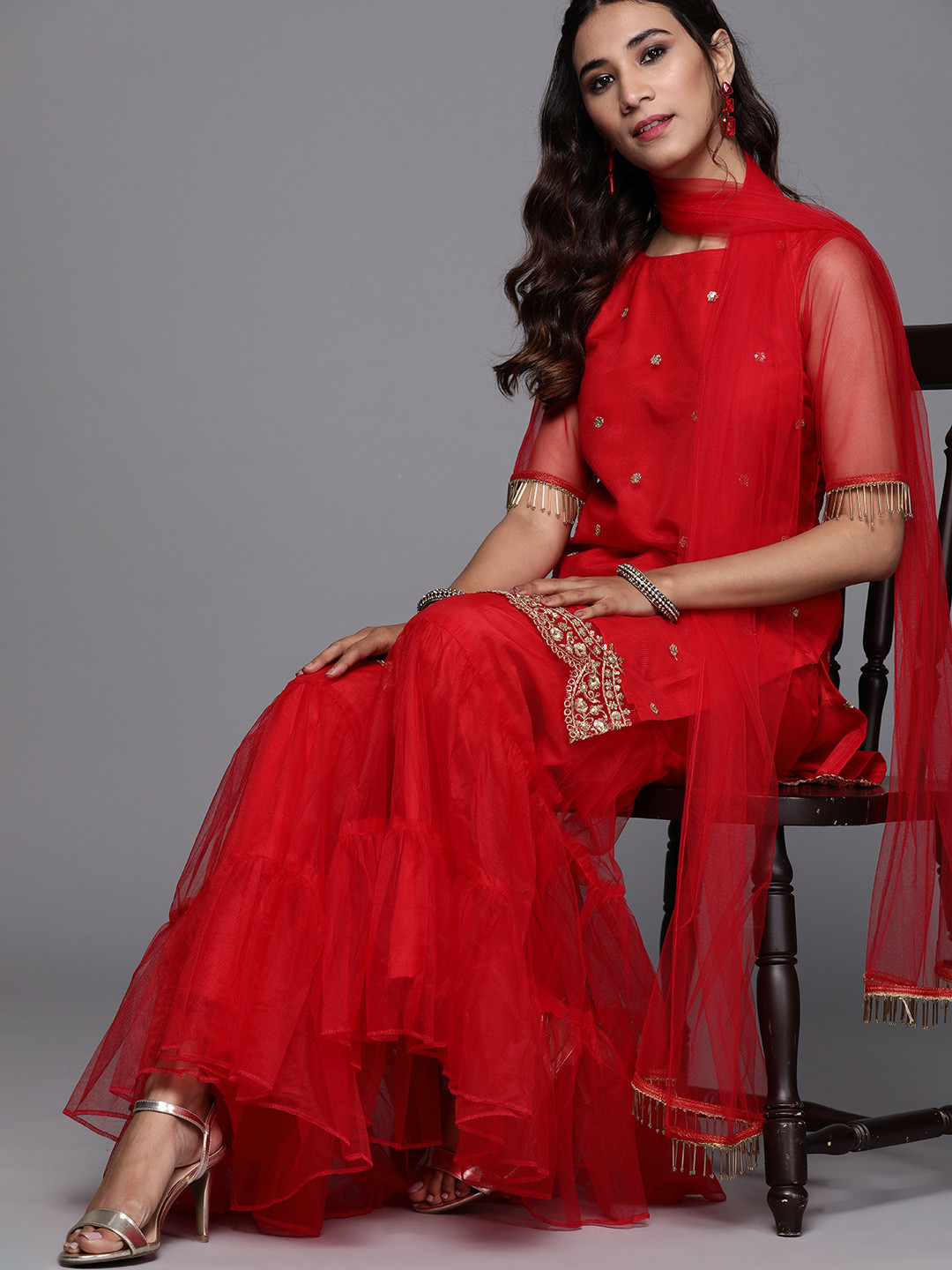 

Inddus Women Red Ethnic Motifs Embroidered Regular Sequinned Kurta with Sharara & With Dupatta