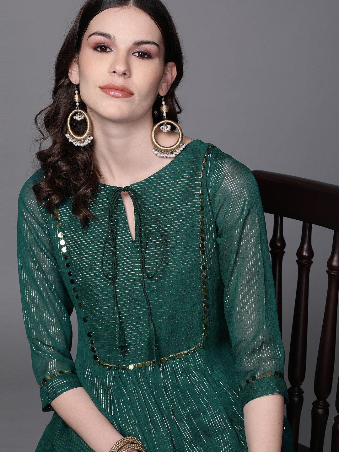 

Inddus Women Green & Golden Self-Striped Kurta with Trousers
