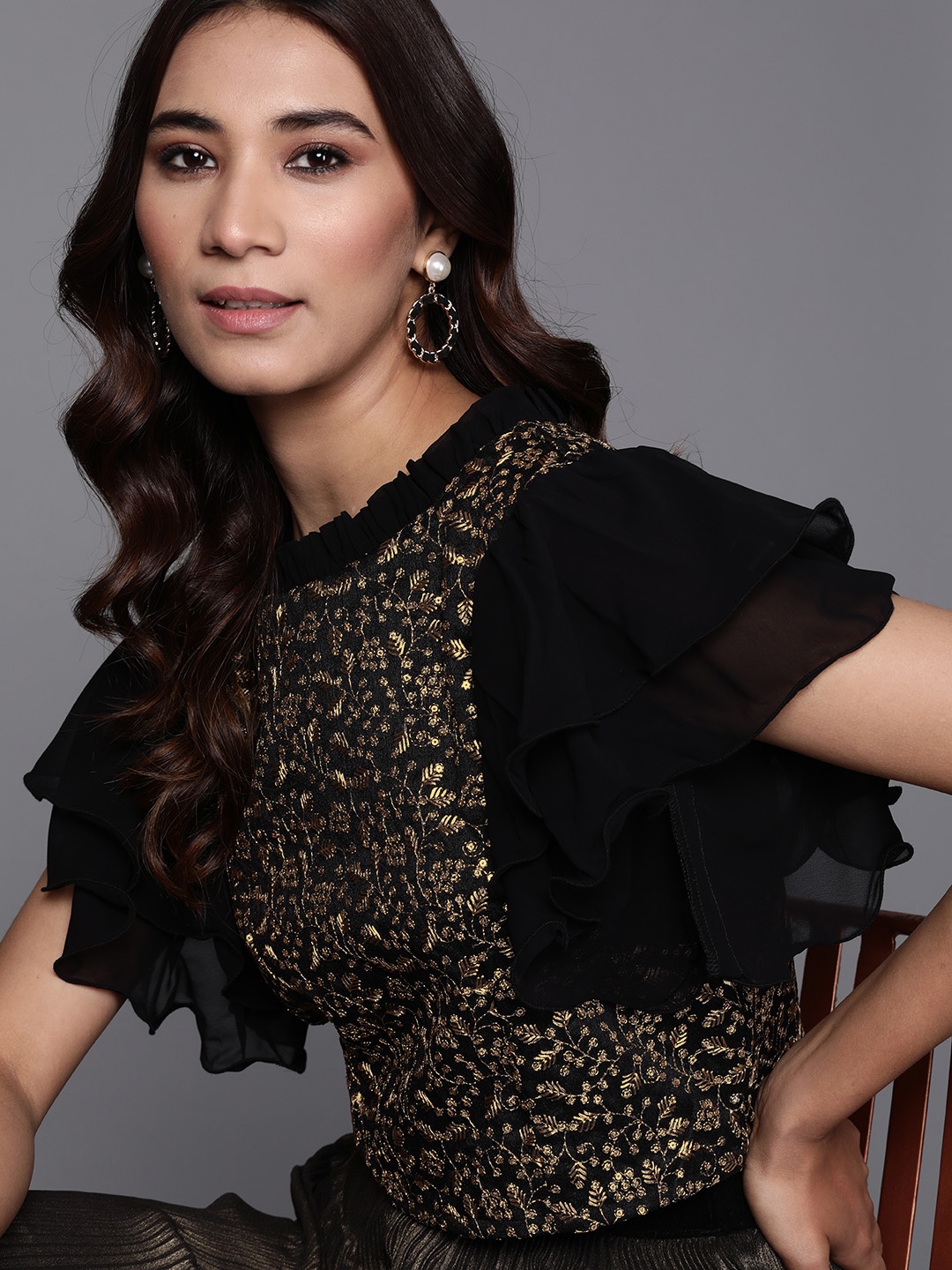 

Inddus Women Black & Golden Embroidered Top