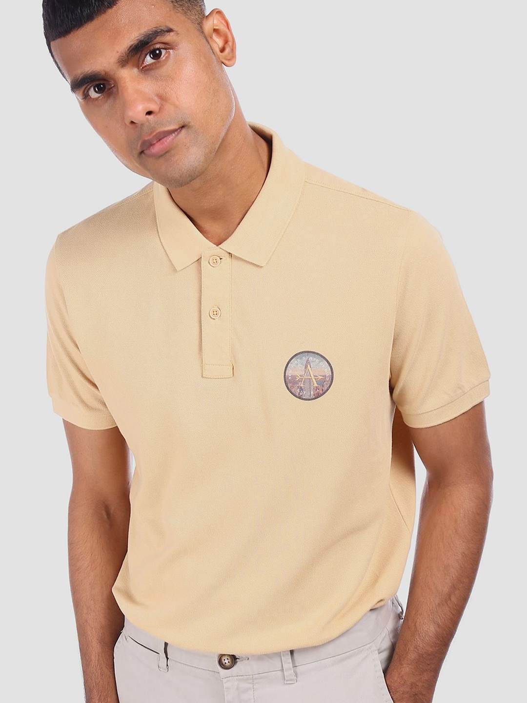 

Arrow Sport Men Beige Solid Polo Collar Pure Cotton T-shirt