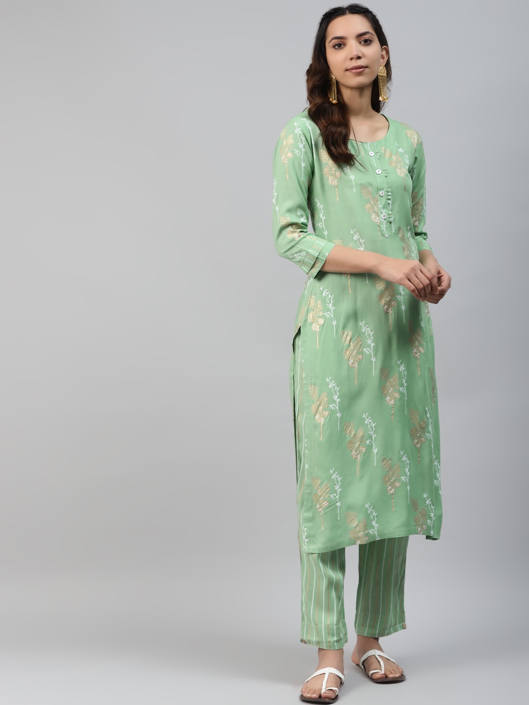 

HIGHLIGHT FASHION EXPORT Women Green & Golden Printed Kurta with Trousers