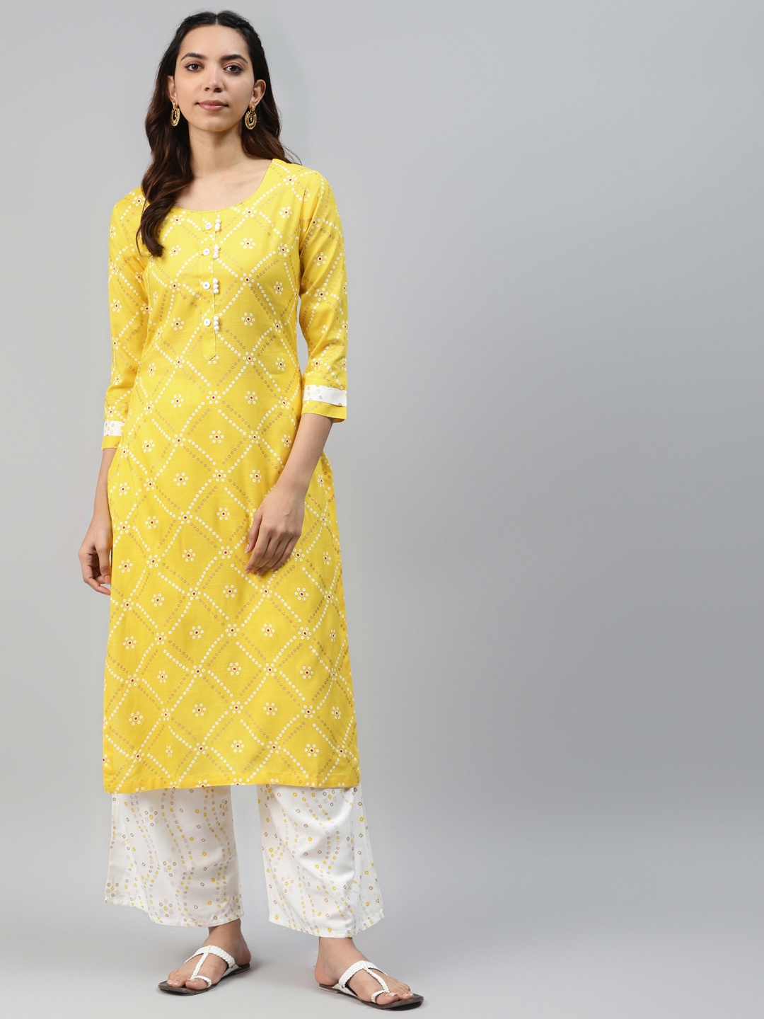 

HIGHLIGHT FASHION EXPORT Women Yellow & White Bandhani Print Kurta with Palazzos