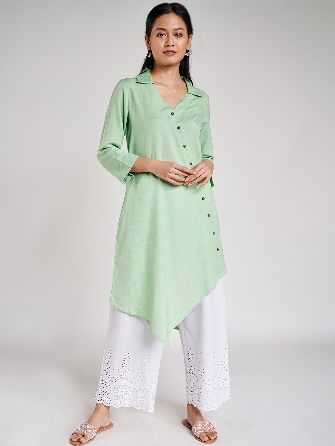

Global Desi Women Green Solid Ecovero Asymmetric Tunic