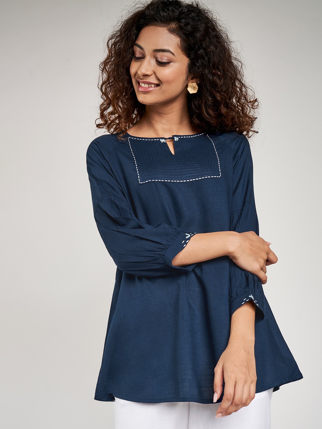 

Global Desi Women Navy Blue Solid Ecovero A-Line Top