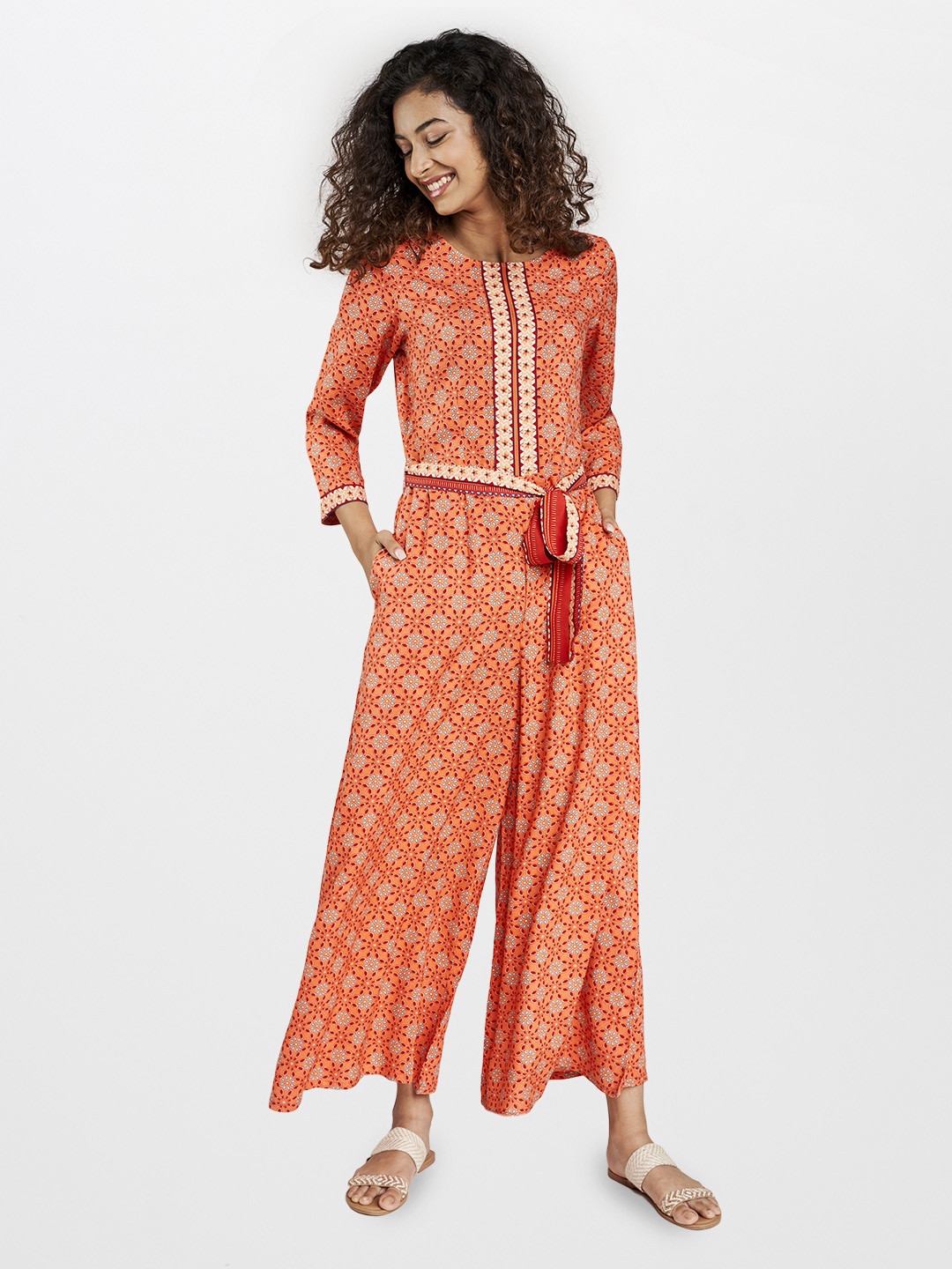 

Global Desi Women Orange & Red Ethnic Motifs Print Sustainable Basic Jumpsuit with Belt