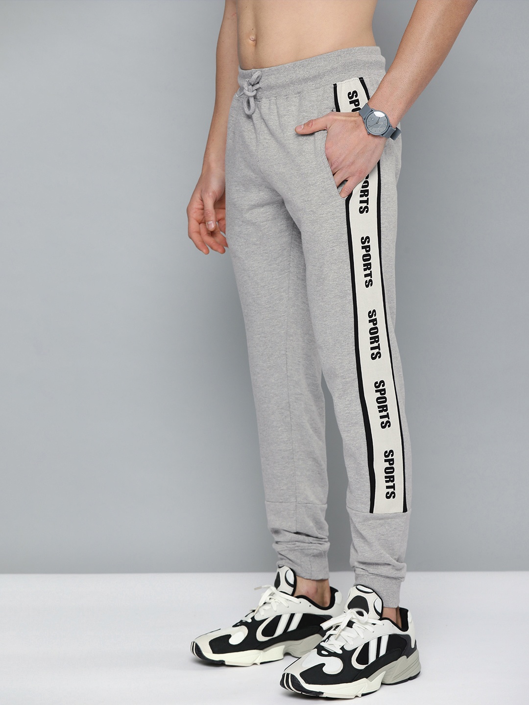

HERE&NOW Men Grey Melange Solid Joggers with Side Taping Detail