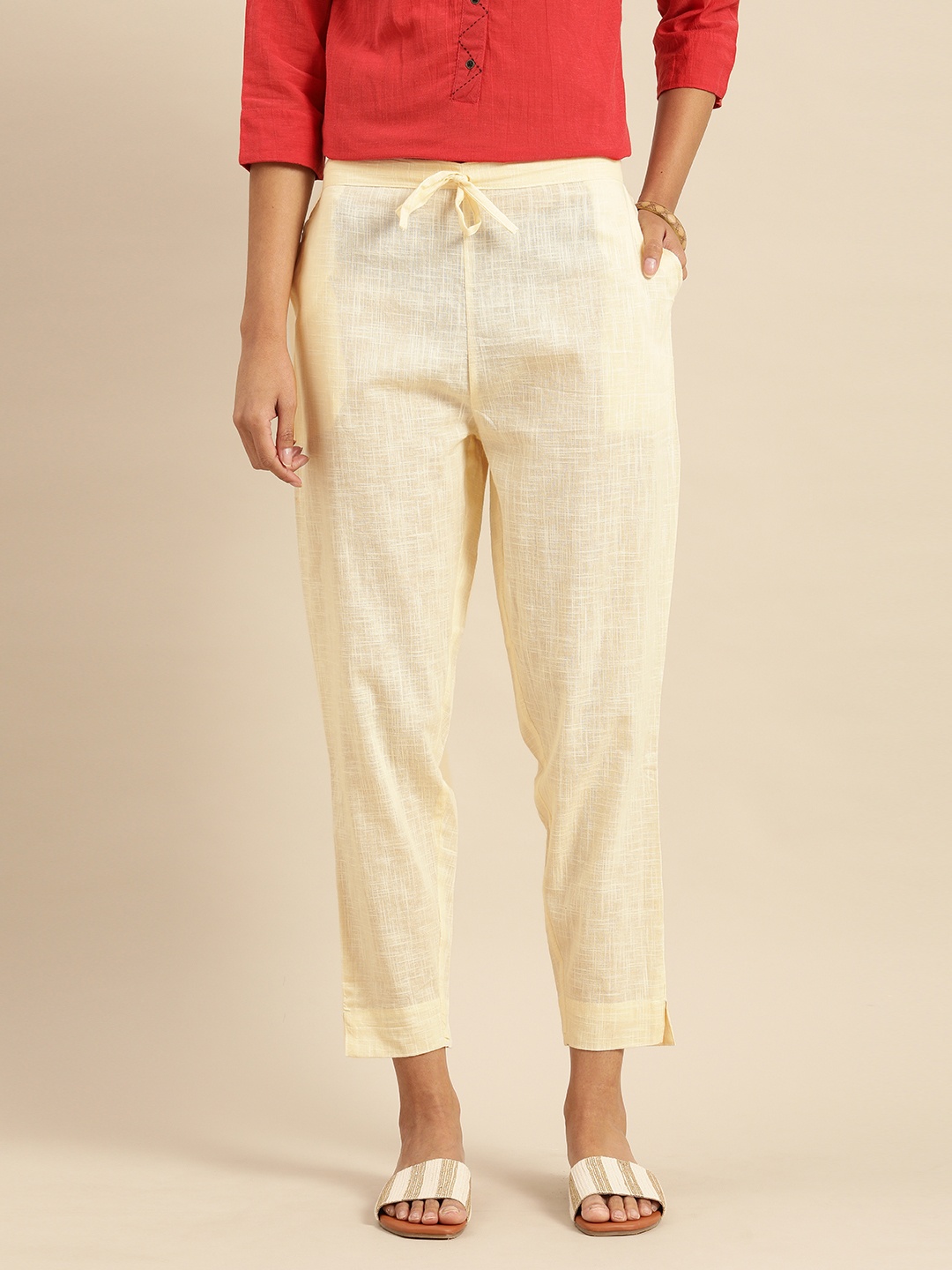 

Rajnandini Women Cream-Coloured Relaxed Straight Leg Self Design Regular Trousers