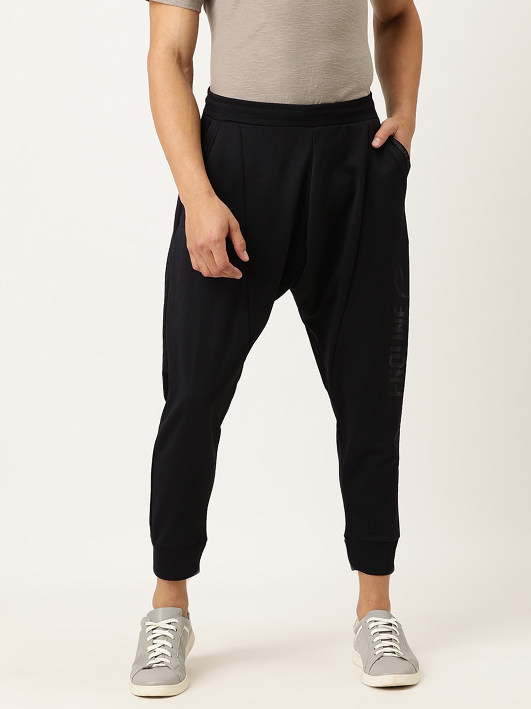 

Proline Active Men Black Harem Fit Solid Cropped Joggers with Logo Print
