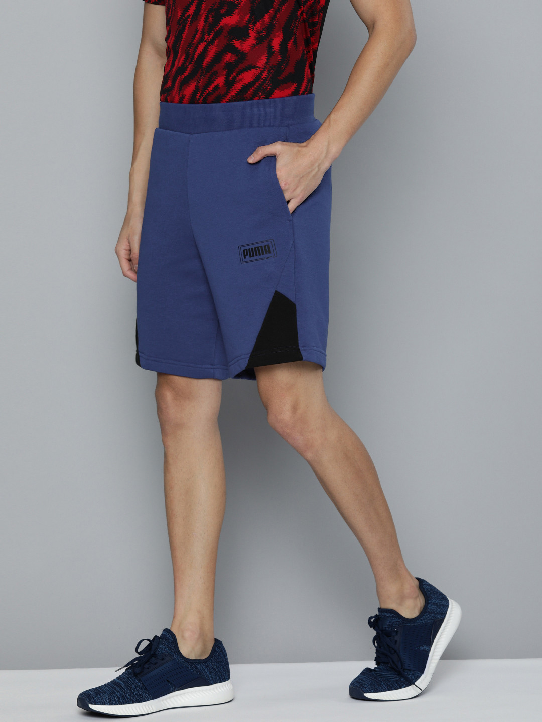 

Puma Men Blue Solid Regular Fit REBEL Sports Shorts