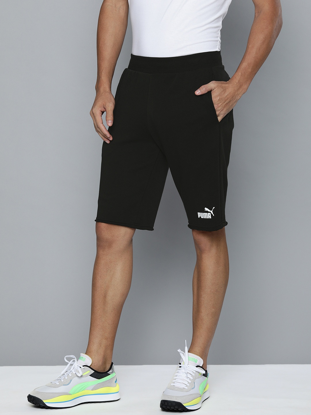 

Puma Men Black Solid Regular Fit ESS 12"Regular Shorts