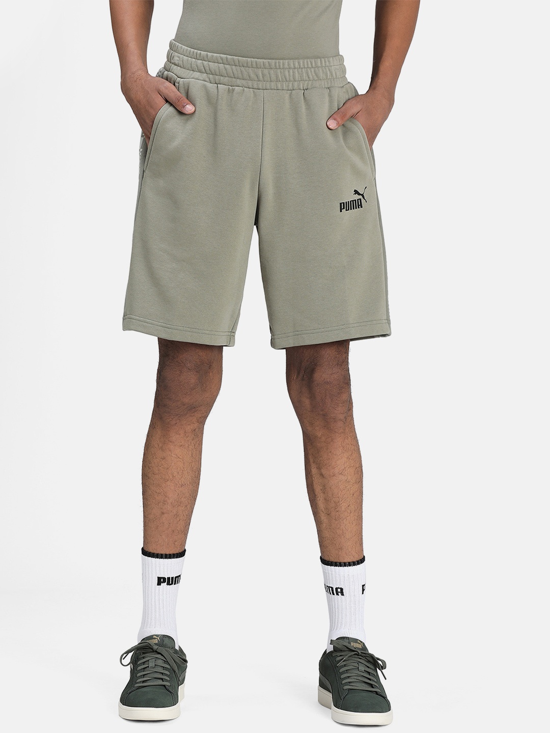 

Puma Men Olive Green Solid Regular Fit Regular Shorts