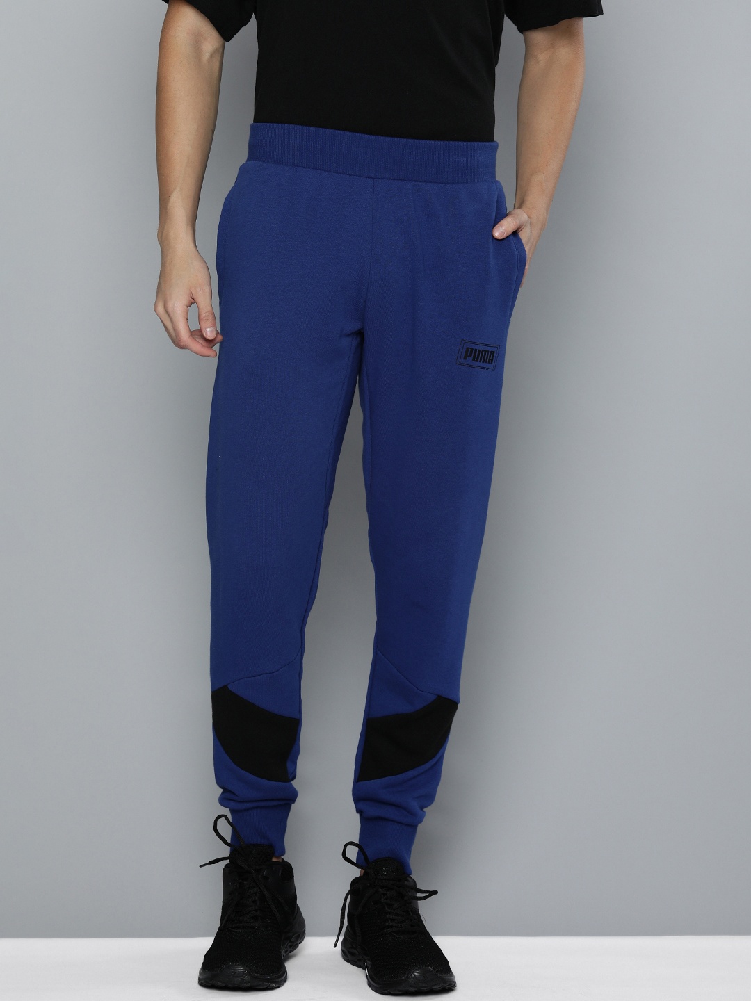 

Puma Men Navy Blue & Black Solid REBEL Joggers