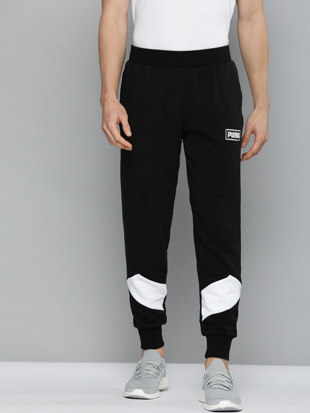 

Puma Black Solid Slim Fit Pants Rebel Pant TR Joggers With Graphic Rubber Print
