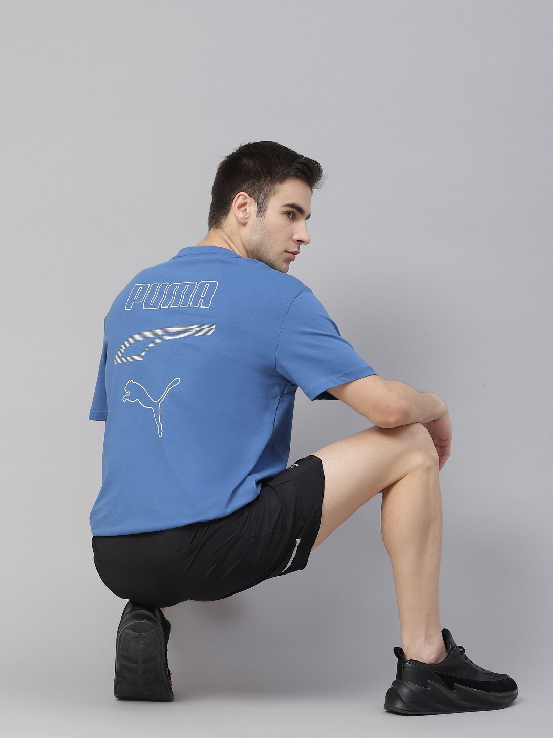 

Puma Men Blue White Printed REBEL Graphic Tee