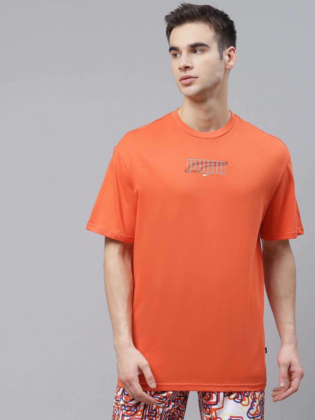 

PUma Men Orange Rebel Graphic Back Print Pure Cotton T-Shirt