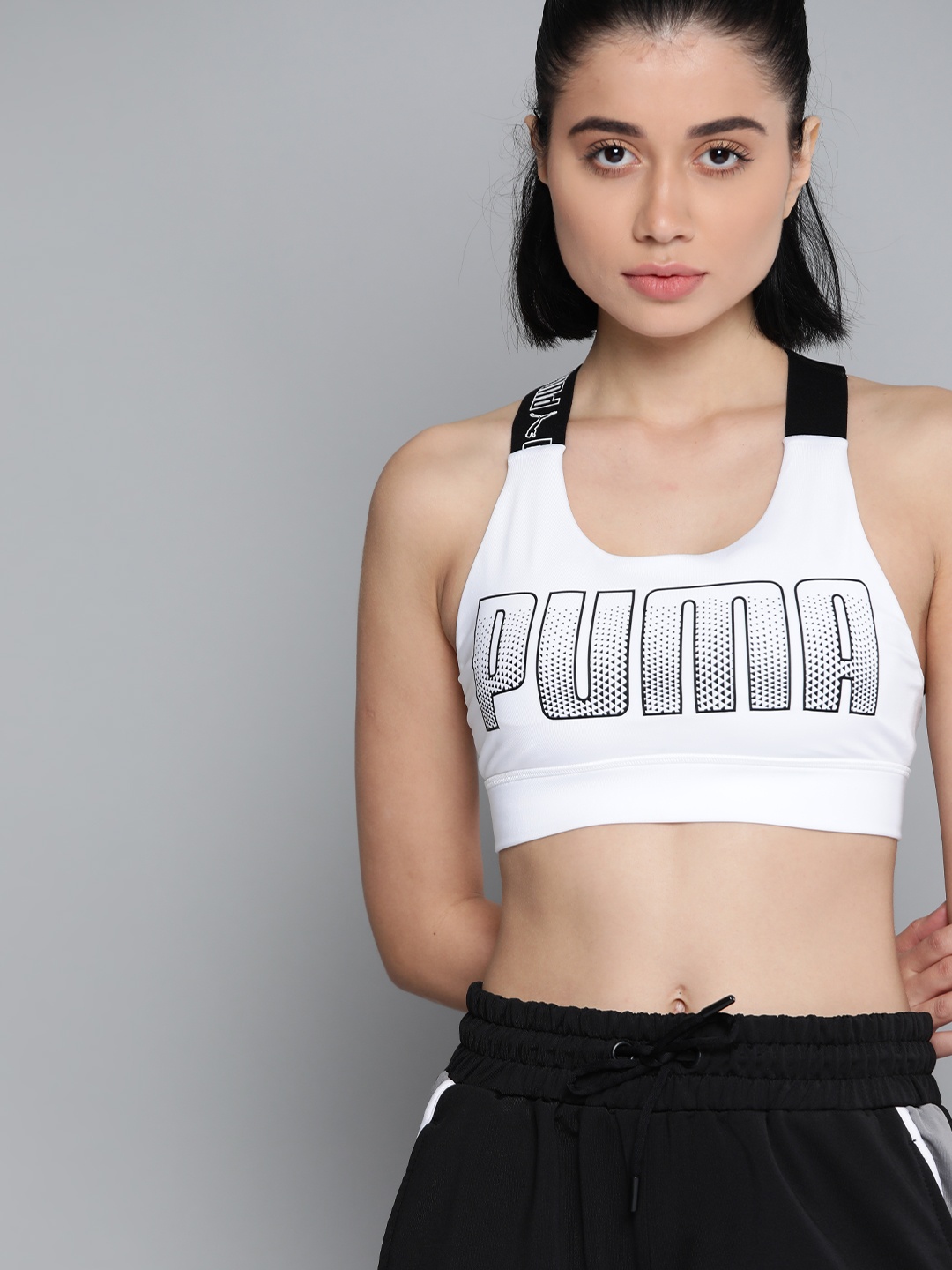 

Puma White & Black Printed Feel It Mid Impact Bra 52029902