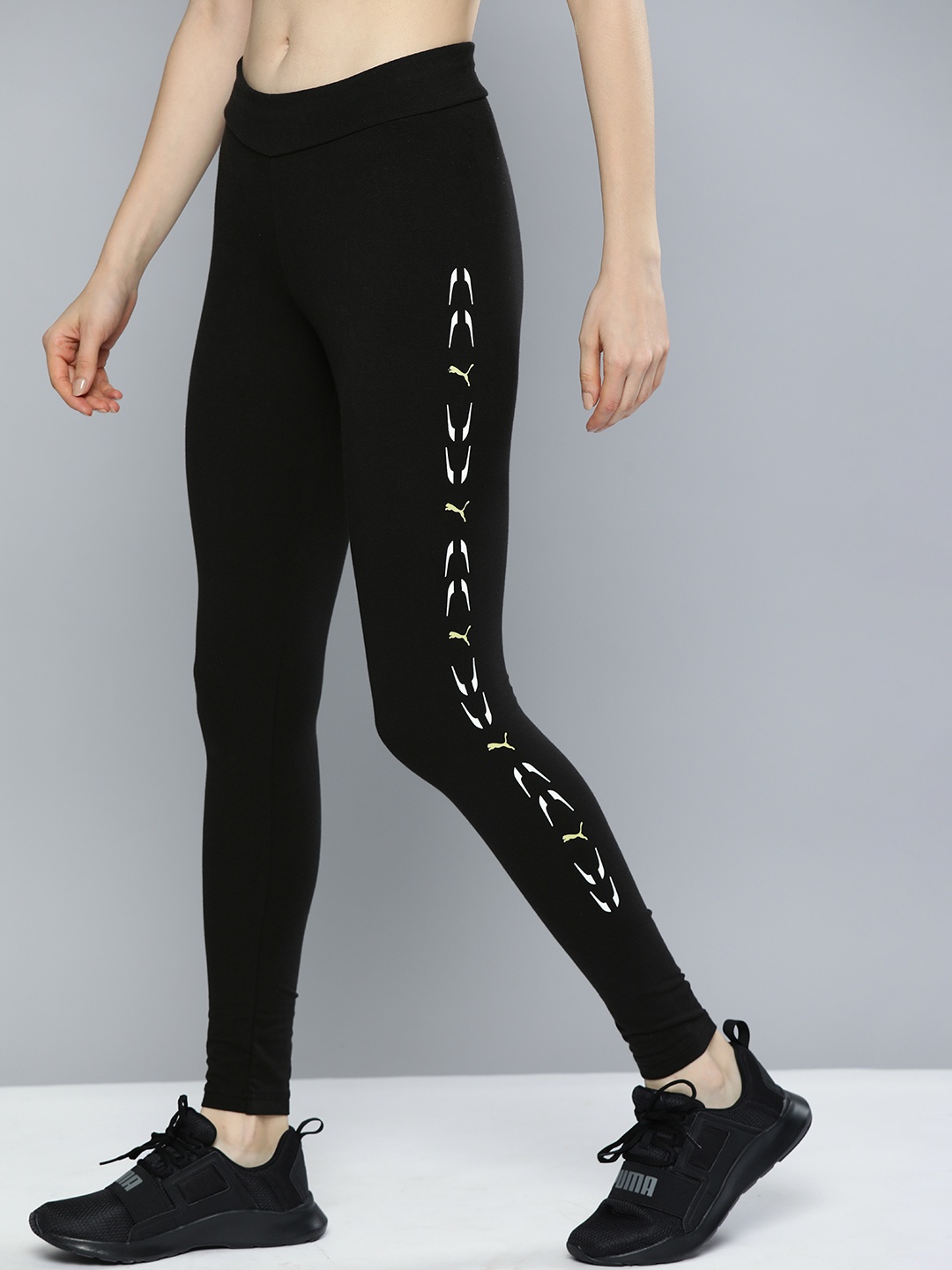 

Puma Women Black Solid ELEVATE Leggings With Printed Side Stripes