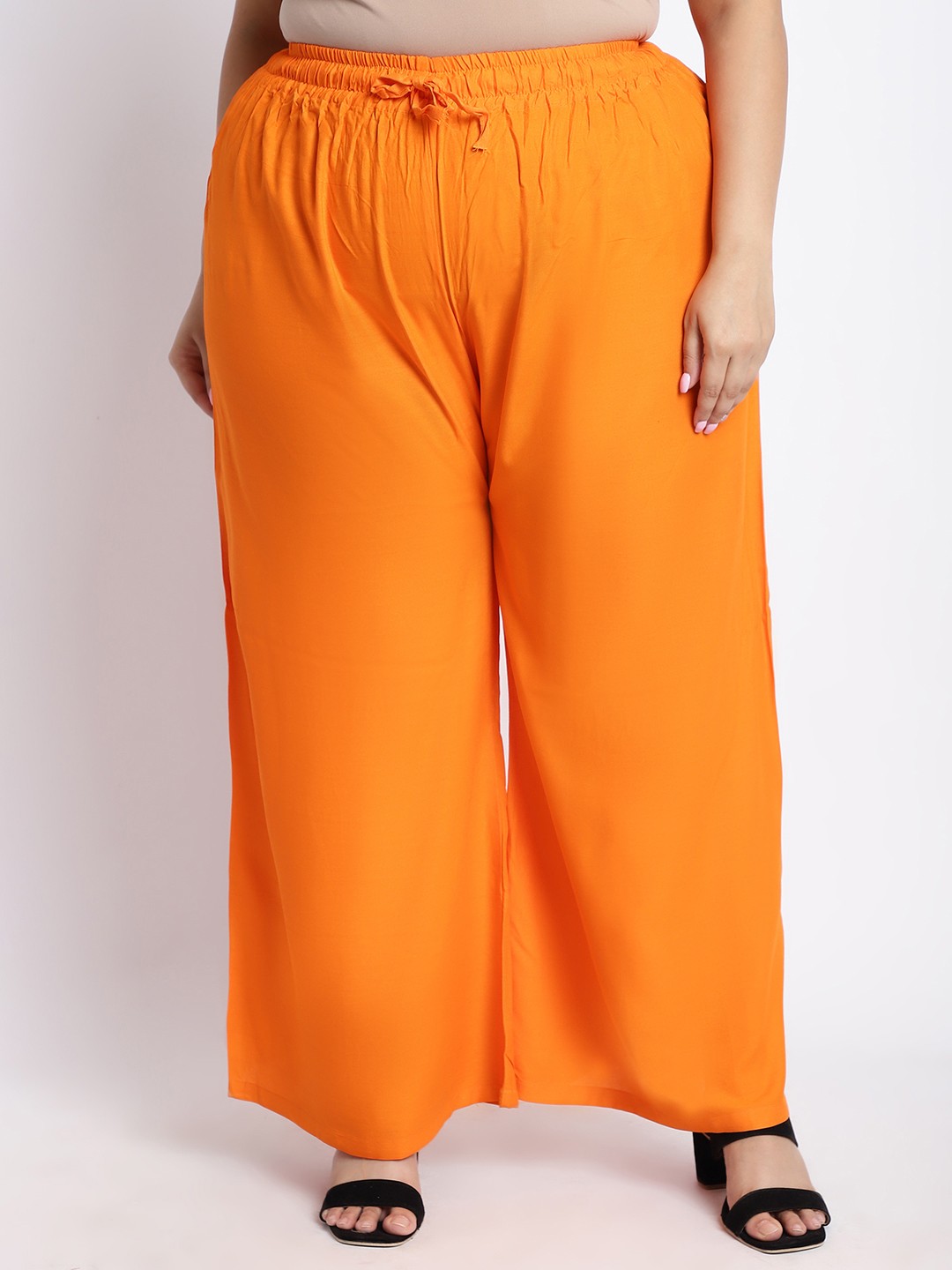 

TAG 7 PLUS Women Orange Solid Flared Palazzo