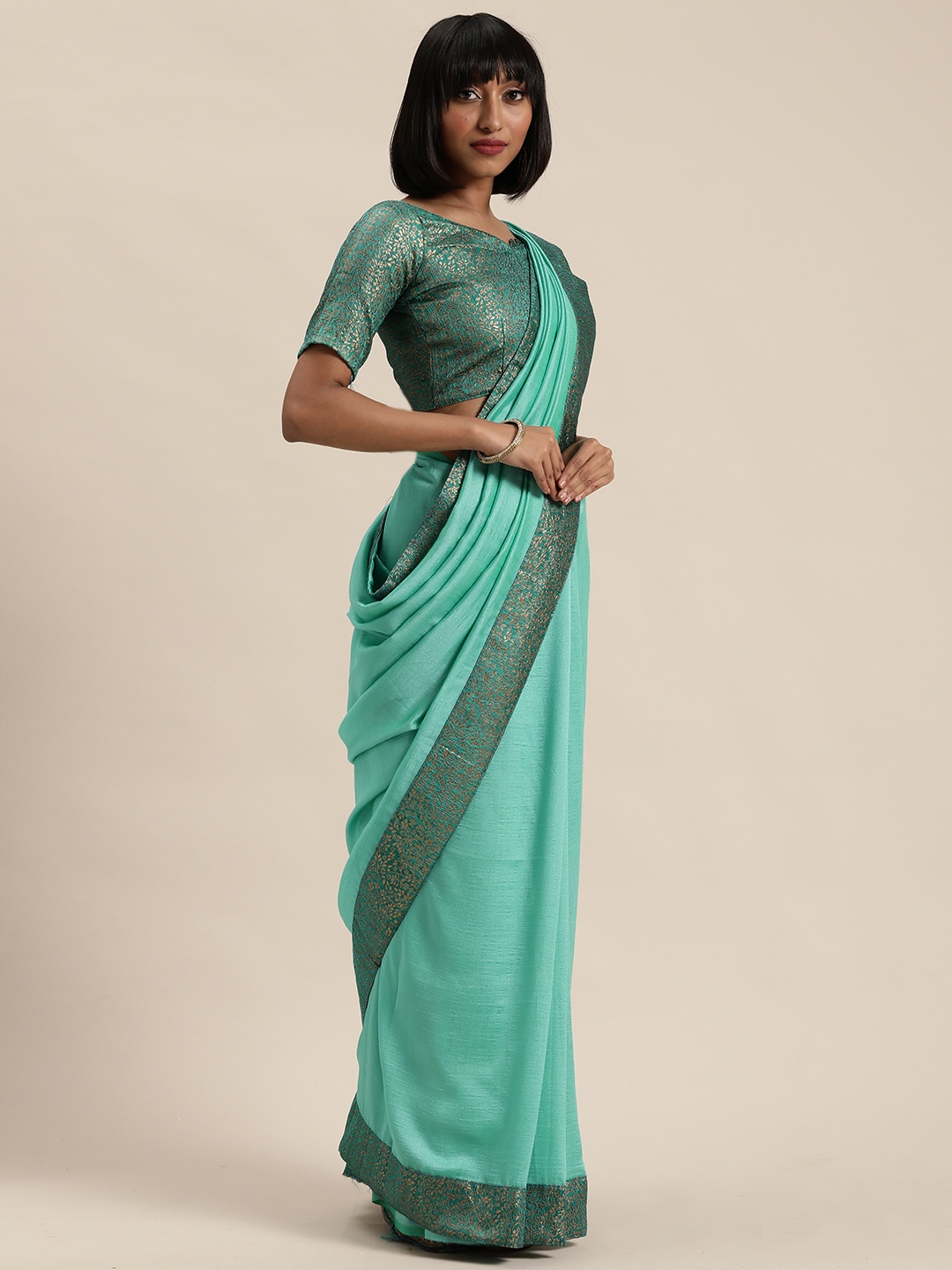 

Mitera Turquoise Blue & Gold-Toned Solid Silk Blend Saree